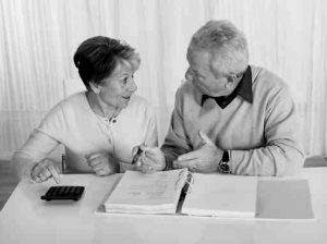 Stressed Senior Couple Calculating Budget